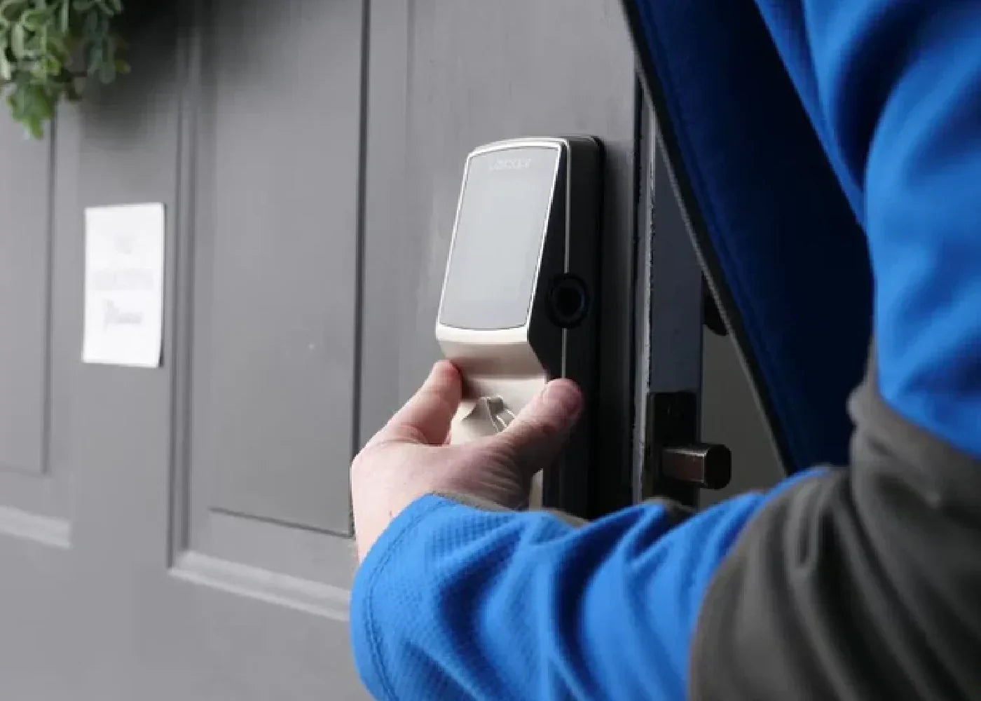 A person who used a smart lock buying guide to select which door lock to install.