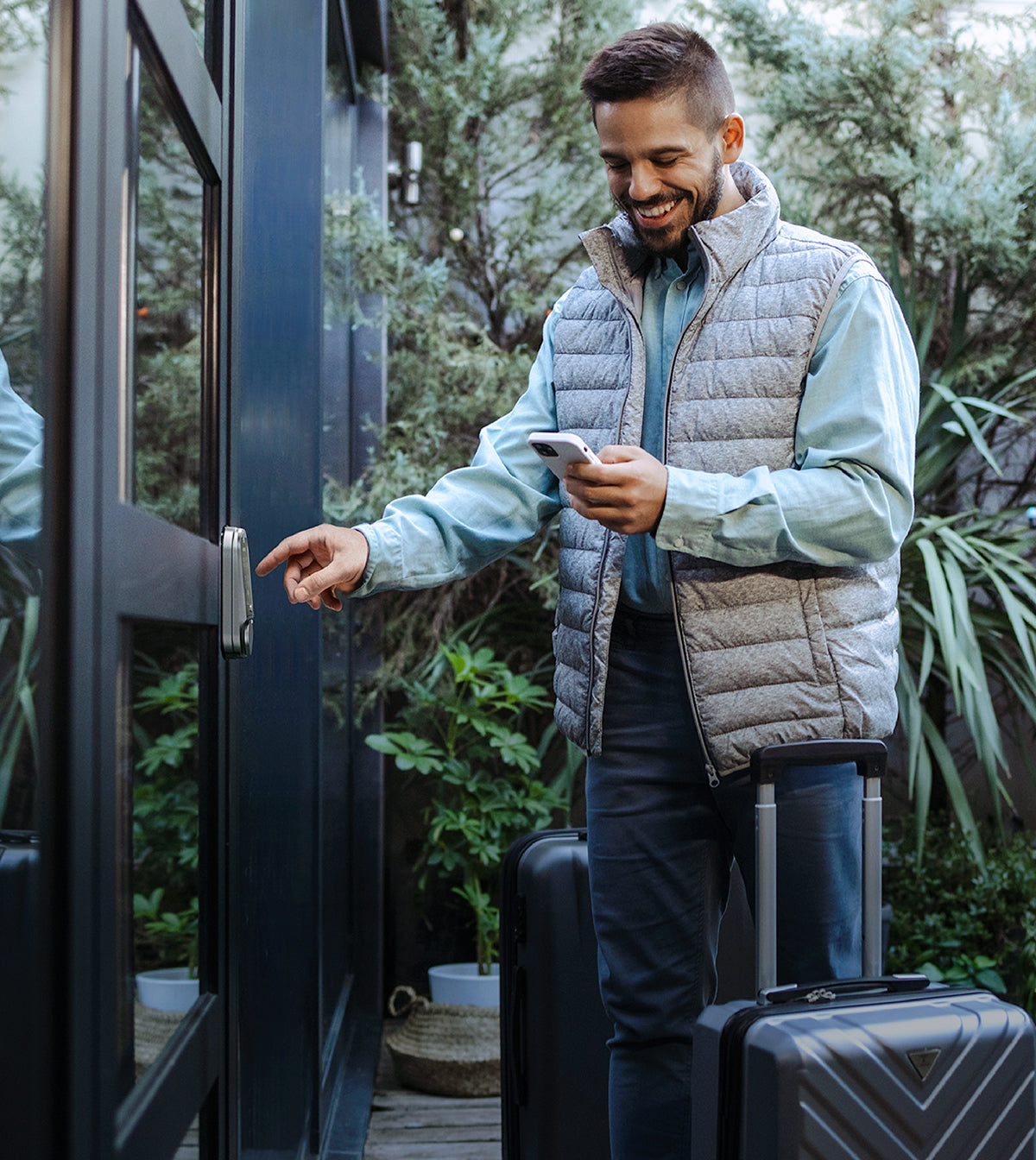 Man putting in code for smart lock