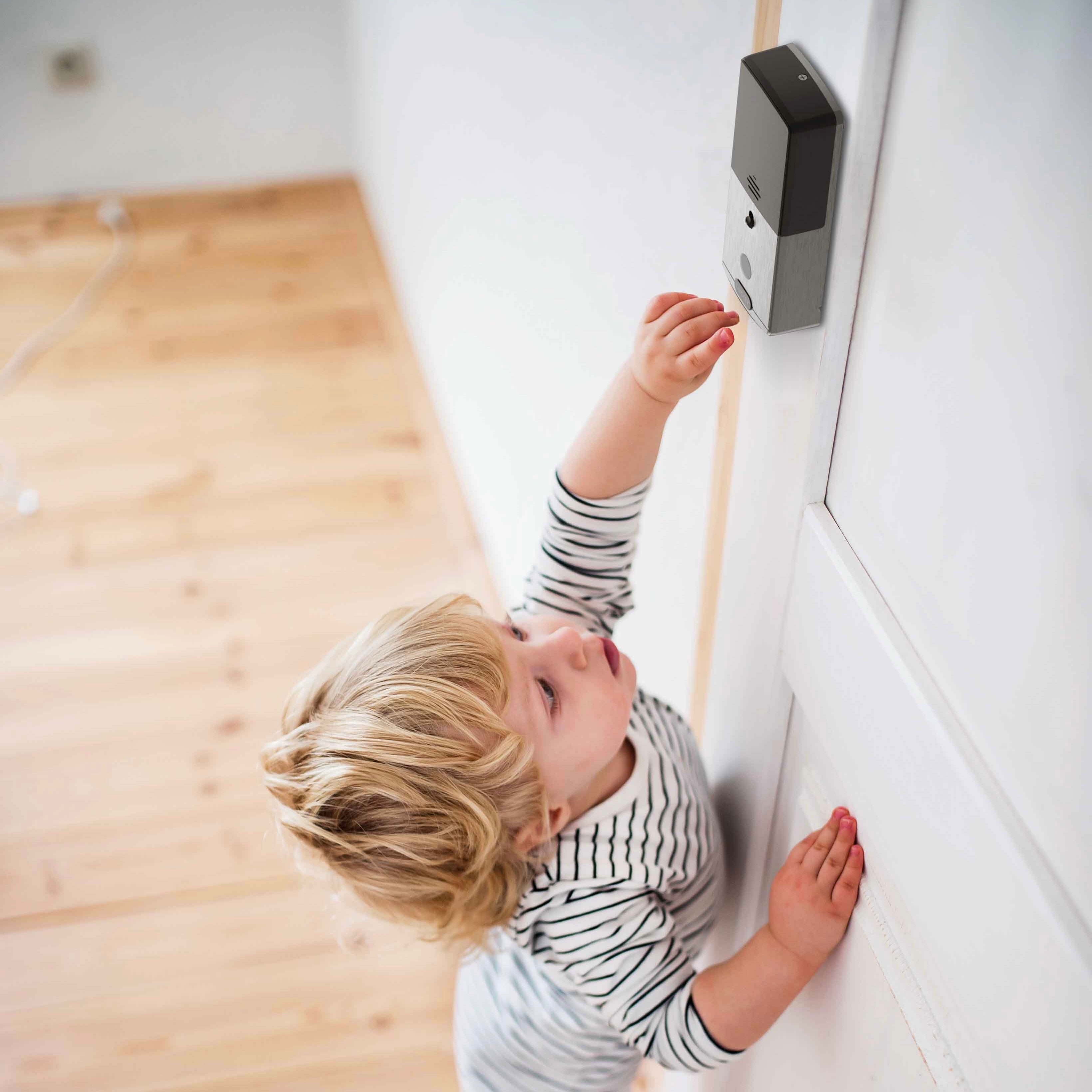 A little kid trying to unlock the Lockly Secure Pro Childproof smart lock